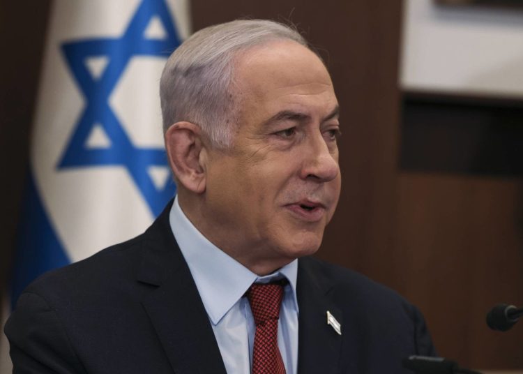 Israeli Prime Minister Benjamin Netanyahu attends the weekly cabinet meeting at the Prime Minister's office in Jerusalem, Sunday, Dec. 10, 2023. (Ronen Zvulun/Pool Photo via AP)